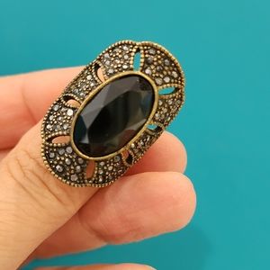 Antique gold tone oval black glass ring, size 7